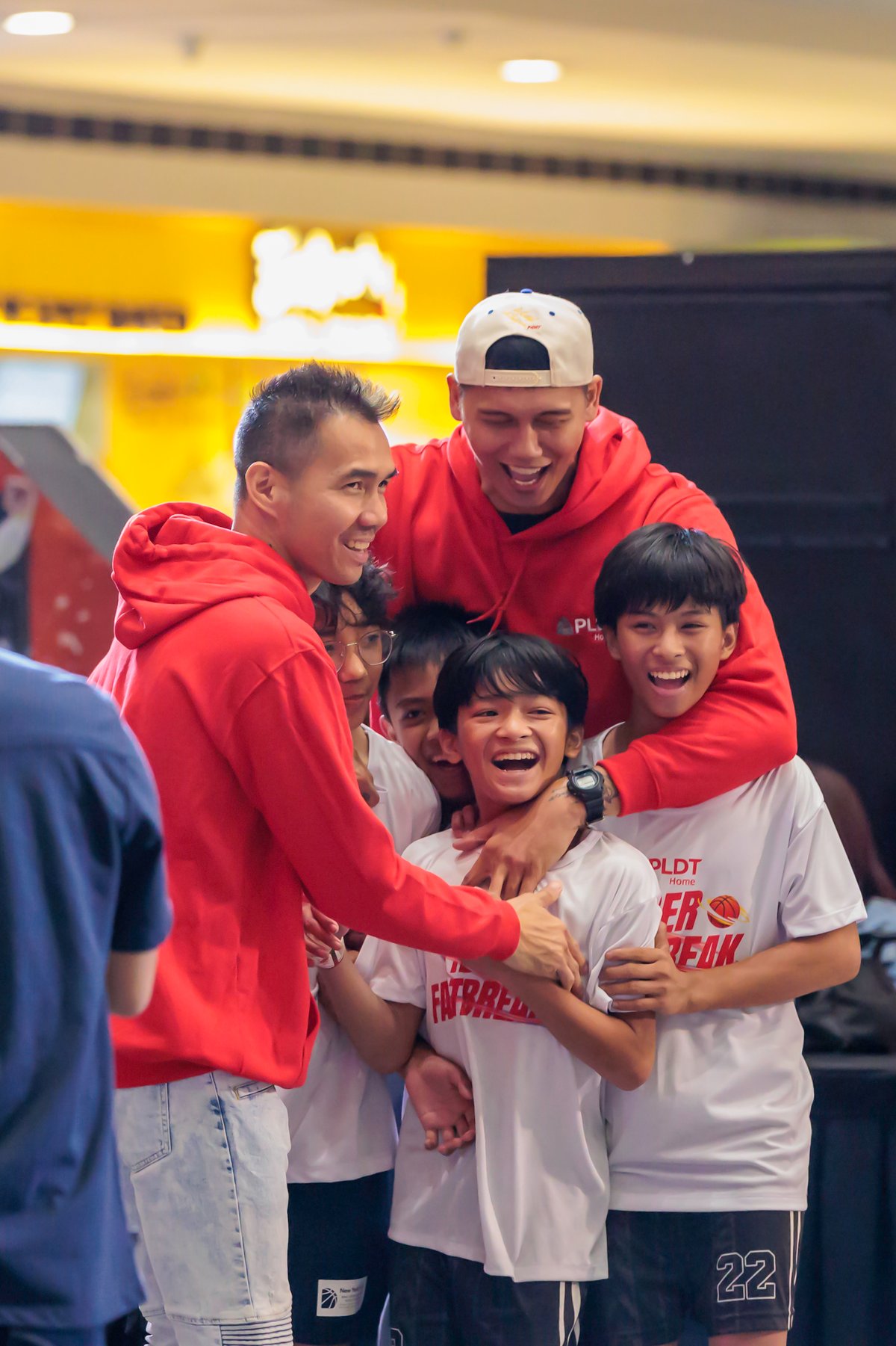Bonding time: PBA stars Cyrus Baguio and Poy Erram have the laughs while teaching 8- to 14-year-olds the basics in basketball.